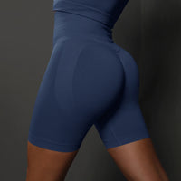 Legging Cycliste Gainant Femme bleu marine sculptant et confortable, taille haute pour maintien optimal et silhouette affinée.