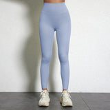 Legging Drainant Anti Cellulite bleu clair porté, taille haute, confortable et sculptant la silhouette.
