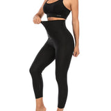 Legging de Sudation Anti Cellulite noir taille haute porté par une femme active, ajusté et confortable pour le sport.