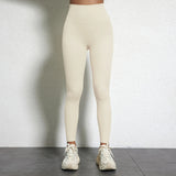 Legging Drainant Anti Cellulite beige porté, ajusté, confortable, idéal pour sport et quotidien avec style moderne et taille haute.