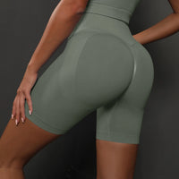 Legging Cycliste Gainant Femme vert kaki moulant, taille haute pour un effet sculptant et maintien optimal.