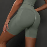 Legging Cycliste Gainant Femme vert kaki moulant, taille haute pour un effet sculptant et maintien optimal.