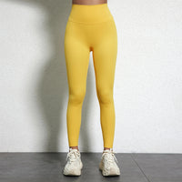 Legging Drainant Anti Cellulite jaune porté, leggings confortables et ajustés pour réduire la cellulite au quotidien.