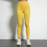 Legging Drainant Anti Cellulite jaune porté, leggings confortables et ajustés pour réduire la cellulite au quotidien.