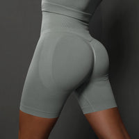 Legging Cycliste Gainant Femme bleu gris, taille haute, effet sculptant et confort optimal pour femmes actives.