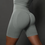 Legging Cycliste Gainant Femme bleu gris, taille haute, effet sculptant et confort optimal pour femmes actives.