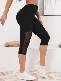 Legging Court Semi Transparent Femme noir avec empiècement mesh sur les cuisses et taille haute ajustée.