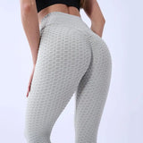 Legging Anti Cellulite France gris texturé porté, conçu pour sculpter la silhouette et réduire la cellulite efficacement.