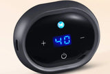 Ceinture chauffante massante dos avec affichage digital LED bleu, boutons de controle et logo lumineux sur boitier noir ovale