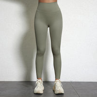 Legging Drainant Anti Cellulite vert olive porté, design épuré et confort optimal pour sport et quotidien.