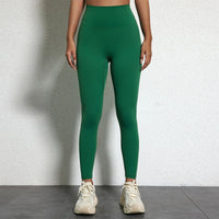 Legging Drainant Anti Cellulite vert porté, coupe ajustée avec taille haute pour confort et silhouette affinée.