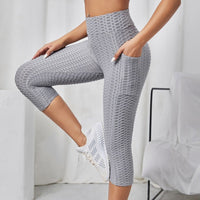 Legging court anti cellulite femme gris vue de profil