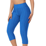 Legging court anti cellulite bleu porté par une  femme
