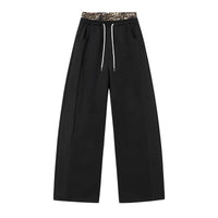 Pantalon large noir taille haute avec ceinture léopard 6