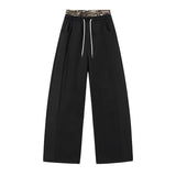 Pantalon large noir taille haute avec ceinture léopard 6
