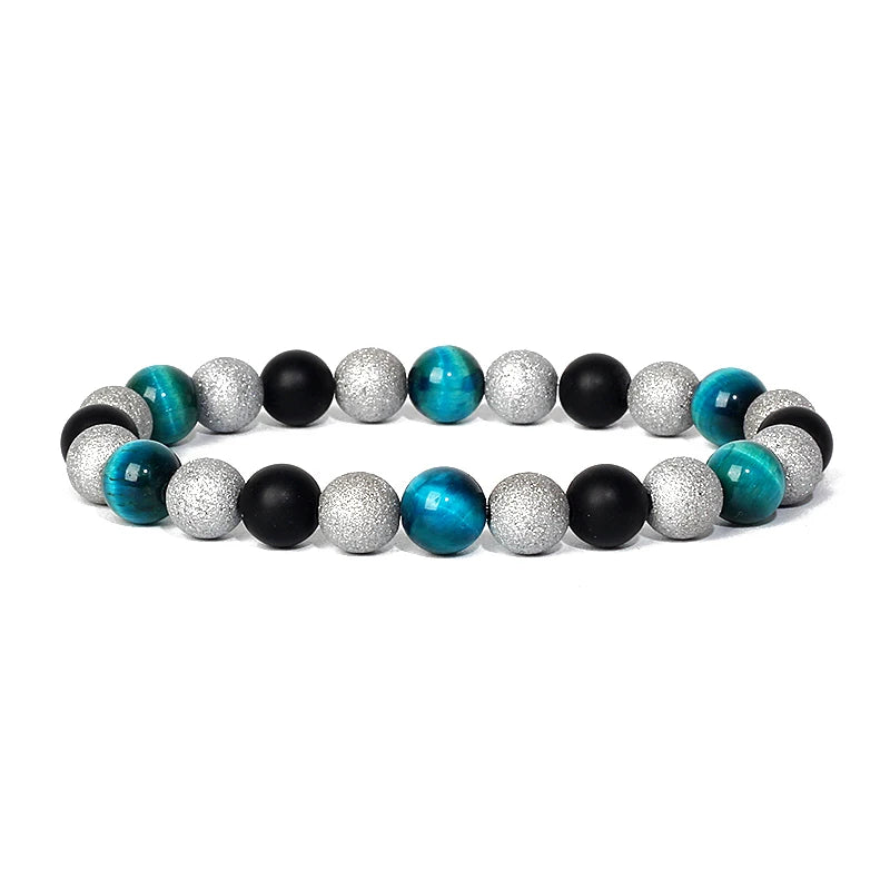 Bracelet magnetique pour maigrir avec perles turquoises, noires et argentees texturees disposees en alternance elegante